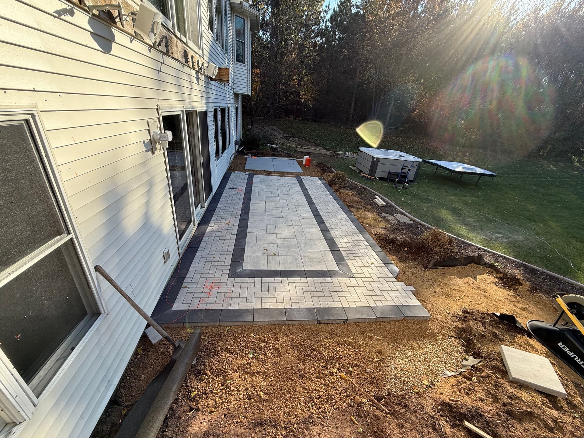 Custom Paver Patio With Hot Tub Pad and Overhead Deck