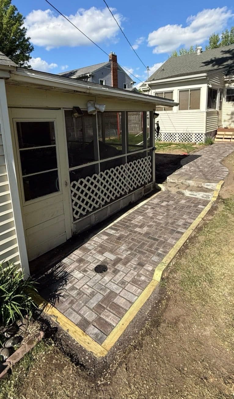 Permeable Paver Walkway Solves a Real Backyard Drainage Problem image